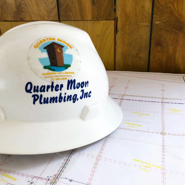 Quarter moon plumbing logo on helmet