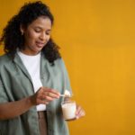 woman making a heated beverage