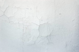 white wall cracked with moisture