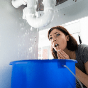 woman notices a water leak under sink